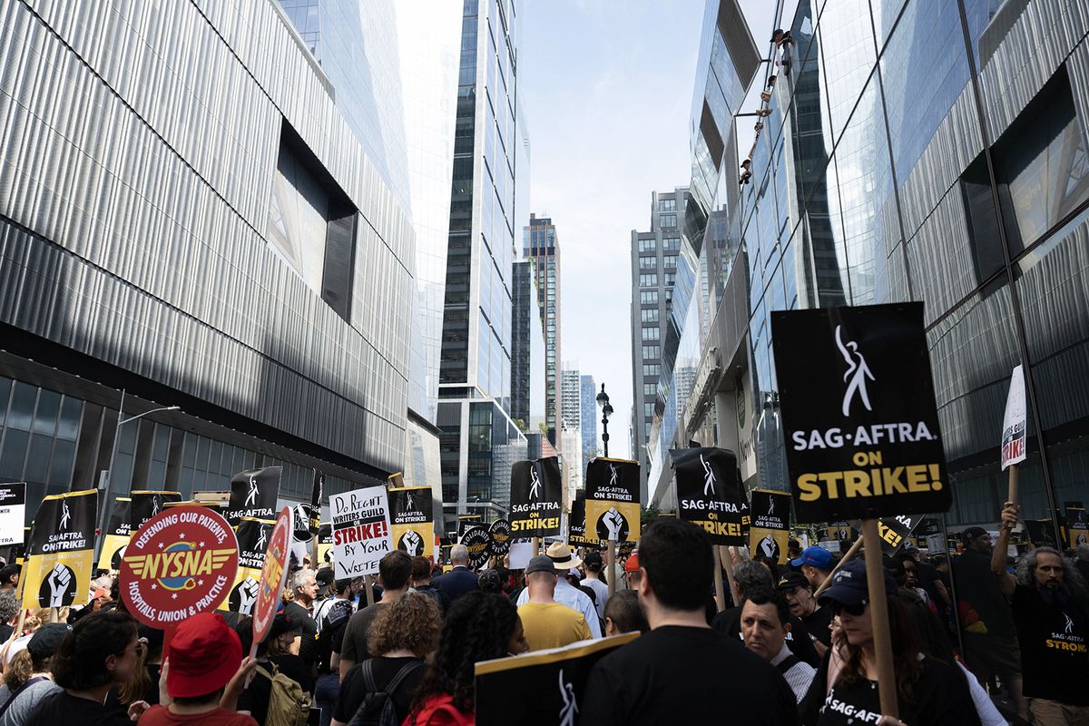 NEW YORK, UNITED STATES - AUGUST 22: Members and supporters of WGA and SAG-AFTRA maintain the picket line outside HBO and Amazon during the National Day of Solidarity on August 22, 2023 in New York City, United States. Members of SAG-AFTRA, Hollywood’s largest union which represents actors and other media professionals, joined the strike of WGA (Writers Guild of America) workers in the first joint walkout against the studios since 1960. The strike has shut down Hollywood productions completely with writers in the third month of their strike against the studios. Fatih Aktas / Anadolu Agency (Photo by Fatih Aktas / ANADOLU AGENCY / Anadolu Agency via AFP)