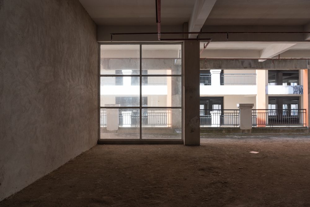 Unfinished,Concrete,Interior,Space,And,Glass,Windows