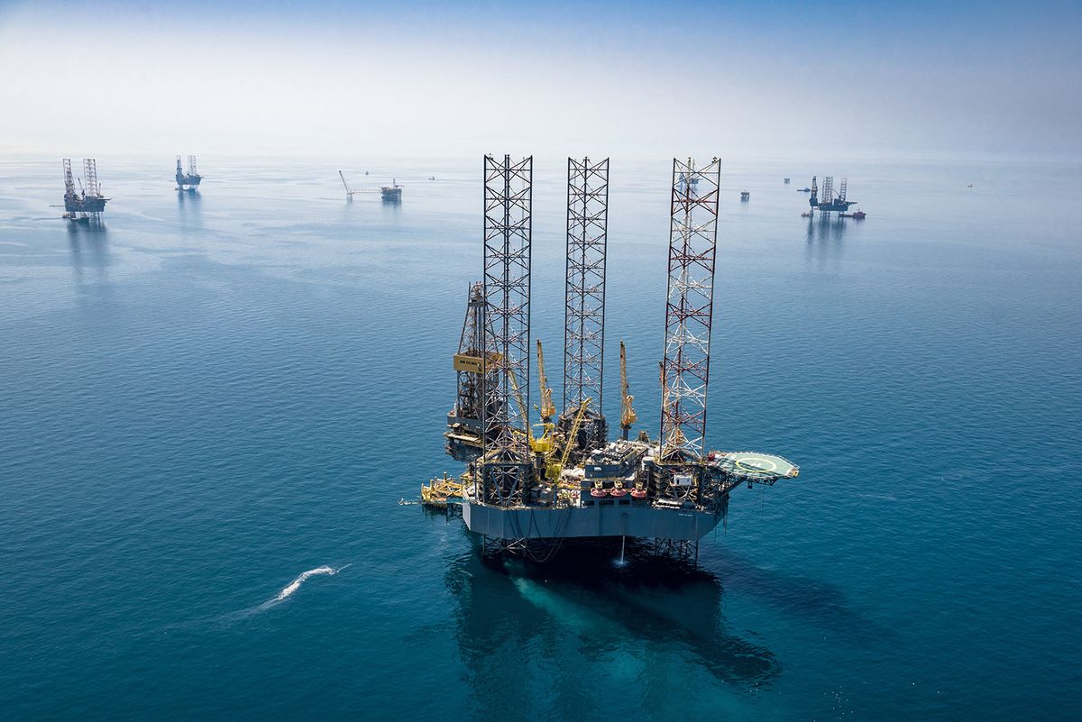 A handout picture provided by Energy giant Saudi Aramco, Saudi Arabia's state-owned oil and gas company, shows its rigs in HSBH field north of Dhahran in the eastern province of Saudi Arabia on March 20, 2018. Aramco posted on May 12, 2020 a 25 percent slump in first-quarter profit and said the coronavirus crisis which triggered a crash in oil prices would weigh heavily on demand in the year ahead. (Photo by Mohamed ALEBN ALSHAIKH / Saudi Aramco / AFP) / === RESTRICTED TO EDITORIAL USE - MANDATORY CREDIT "AFP PHOTO / HO /ARAMCO" - NO MARKETING NO ADVERTISING CAMPAIGNS - DISTRIBUTED AS A SERVICE TO CLIENTS ===