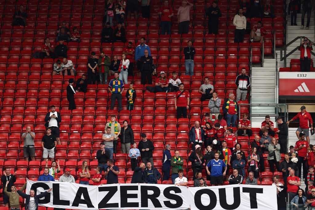 Manchester United fans stage a sit-in against club owners the Glazer family after the English Premier League football match between Manchester United and Nottingham Forest at Old Trafford in Manchester, northwest England, on August 26, 2023. (Photo by Darren Staples / AFP) / RESTRICTED TO EDITORIAL USE. No use with unauthorized audio, video, data, fixture lists, club/league logos or 'live' services. Online in-match use limited to 120 images. An additional 40 images may be used in extra time. No video emulation. Social media in-match use limited to 120 images. An additional 40 images may be used in extra time. No use in betting publications, games or single club/league/player publications. / 
