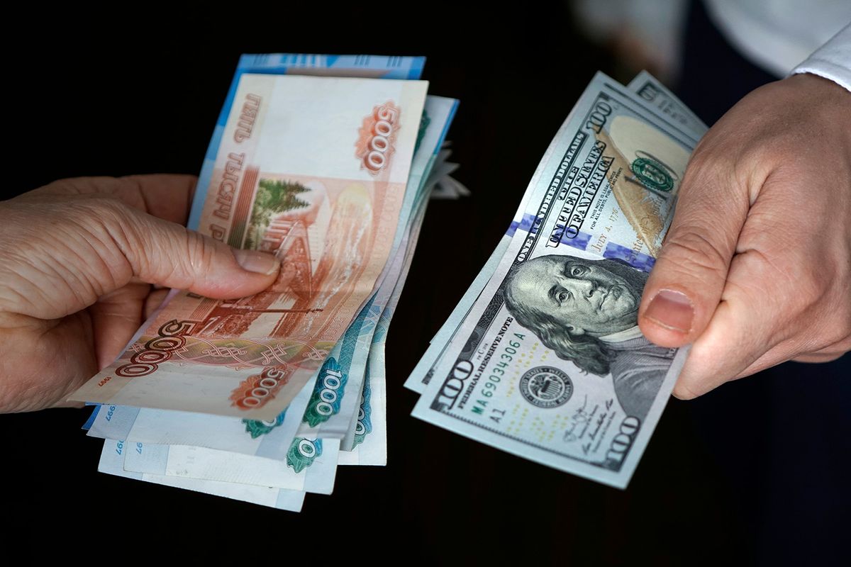 Hands,Holding,Russian,Rouble,And,Us,Dollar,Bills.,Dollars,And