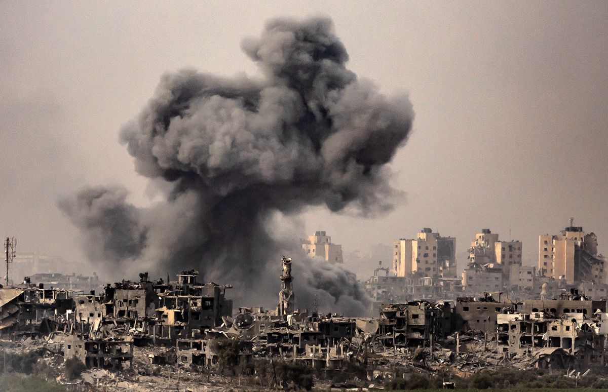 This image taken from the Israeli border with the Gaza Strip on October 29, 2023, shows a black cloud of smoke ascending from the Gaza Strip amid the ongoing battles between Israel and the Palestinian group Hamas. The Israeli army has raised the number of troops fighting inside the Gaza Strip, a spokesman said on October 29, 2023, as the military stepped up its war on Hamas in the tiny Palestinian territory. Thousands of civilians, both Palestinians and Israelis, have died since October 7, 2023, after Palestinian Hamas militants based in the Gaza Strip entered southern Israel in an unprecedented attack triggering a war declared by Israel on Hamas with retaliatory bombings on Gaza. (Photo by FADEL SENNA / AFP)