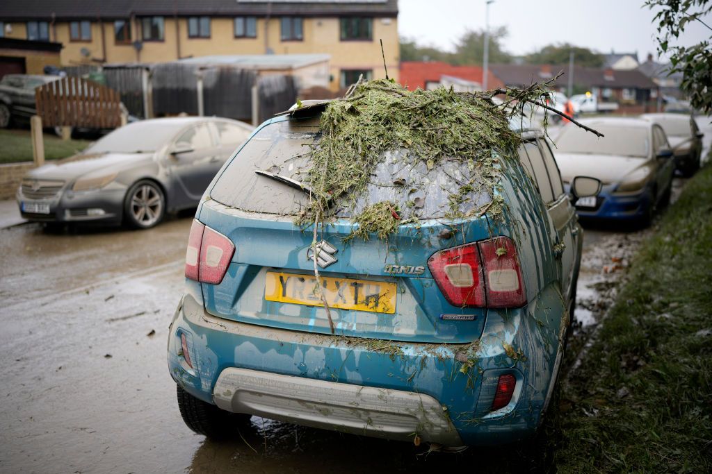 Flood Warnings Remain In Storm Babet's WakeROTHERHAM, UNITED KINGDOM - OCTOBER 23: Damage is seen on a residents car as flood waters recede in the village of Catcliffe after Storm Babet flooded home, business and roads on October 23, 2023 in Rotherham, United Kingdom. The UK Environment Agency has warned that flooding could last for days in the wake of Storm Babet with 116 flood warnings remaining in place across England. (Photo by Christopher Furlong/Getty Images)