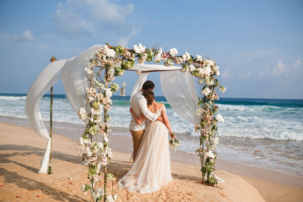 Bride,And,Groom,Enjoying,Beach,Wedding,In,Tropics,,Wedding,Arch,