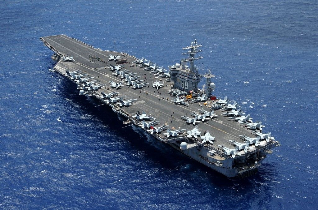 In this image released by the US Department of Defense, the aircraft carrier USS Dwight D. Eisenhower (CVN 69) is returning to homeport at Norfolk, Virginia after operating in the US 5th and 6th Fleet areas of responsibility in support of Operation Enduring Freedom on July 2, 2013. The United States is sending a second aircraft carrier strike group to the eastern Mediterranean "to deter hostile actions against Israel or any efforts toward widening this war following Hamas's attack," Secretary of Defense Lloyd Austin said October 14.
The USS Eisenhower and its affiliated warships will join another carrier group already deployed to the region in the wake of a Hamas attack on Israel a week ago and Israel's ongoing response. (Photo by Ryan D. McLearnon / US Department of Defense / AFP) / RESTRICTED TO EDITORIAL USE - MANDATORY CREDIT "AFP PHOTO /  US Department of Defense/US Navy/Mass Communication Specialist 2nd Class Ryan D. McLearnon" - NO MARKETING NO ADVERTISING CAMPAIGNS - DISTRIBUTED AS A SERVICE TO CLIENTS