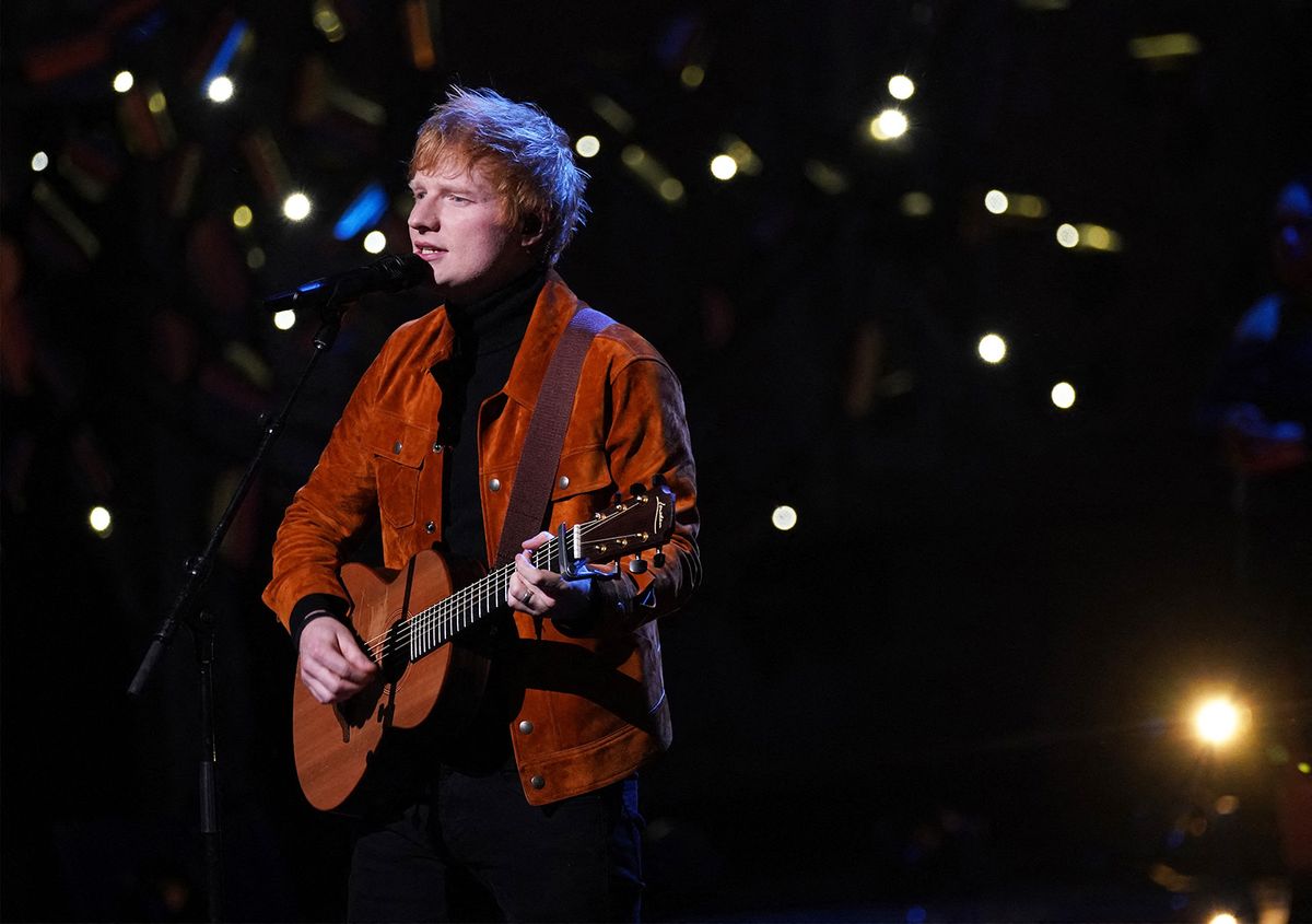 British singer-songwriter Ed  Sheeran performs on stage during the inaugural Earthshot Prize awards ceremony at Alexandra Palace in London on October 17, 2021. The Earthshot Prize honours five inaugural winners with an award of  Ł1 million ($1.4 million, 1.2 million euros) each to pursue solutions to the world's greatest environmental problems at a glitering gala ceremony. Prince William, Duke of Cambridge, launched the prestigious Earthshot Prize in October 2020 and hopes that the event will help propel the fight against climate change leading up to the COP26 summit in Scotland, calling those on the shortlist "innovators, leaders and visionaries". (Photo by Yui Mok / POOL / AFP)