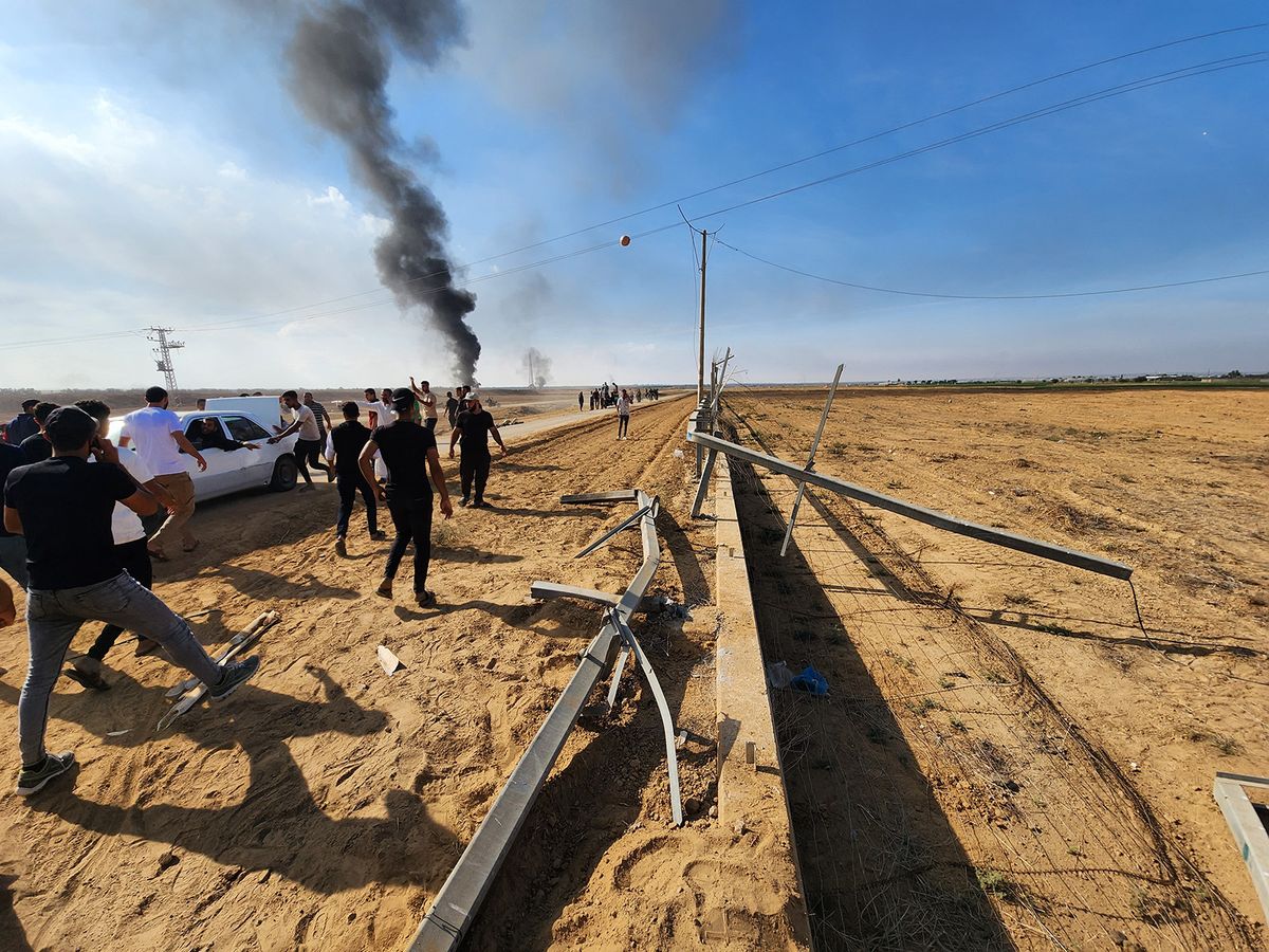 Palestinians take down the Israel-Gaza border