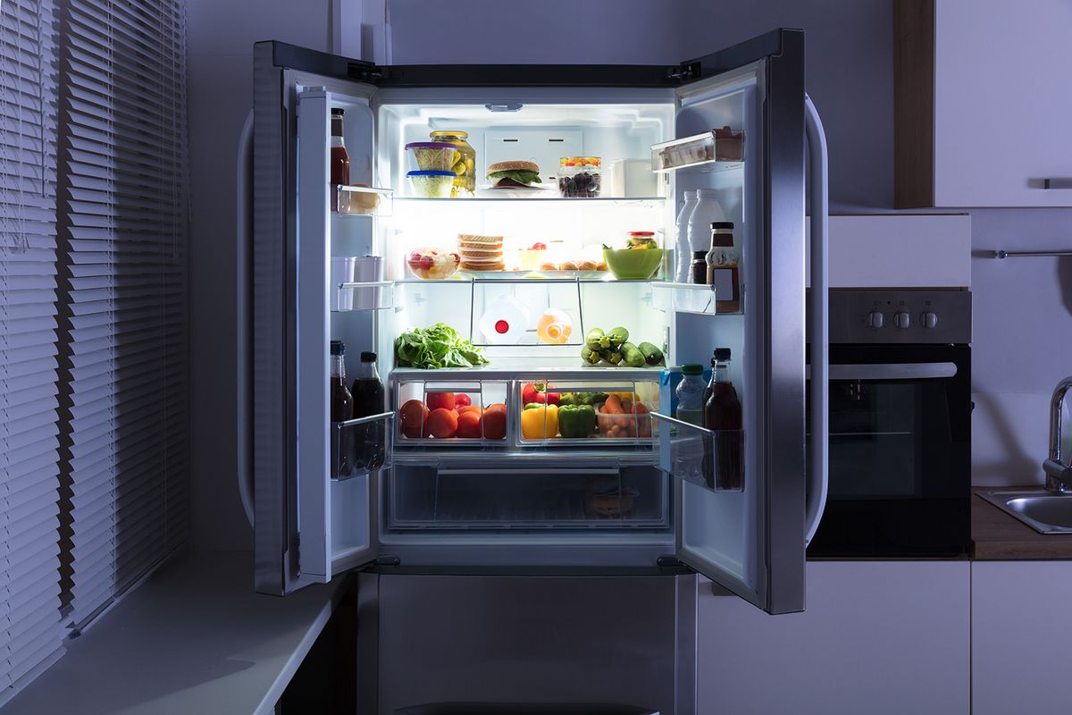 Open,Refrigerator,Full,Of,Juice,And,Fresh,Vegetables,In,Kitchen