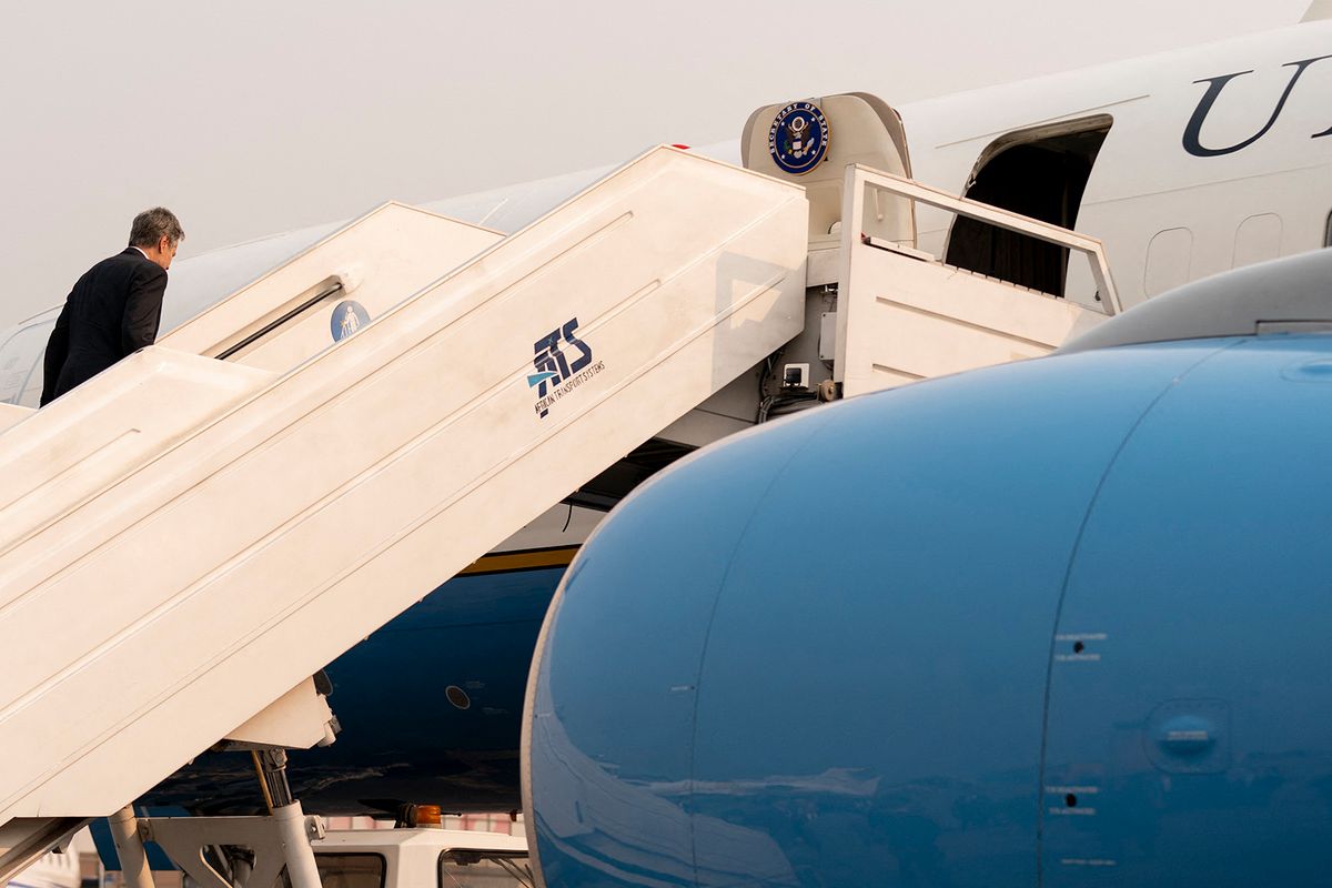 Secretary of State Antony Blinken boards his airplane at N'Djili International Airport in Kinshasa, to travel to Rwanda, on August 10, 2022. Blinken is on a ten day trip to Cambodia, Philippines, South Africa, Congo, and Rwanda. (Photo by Andrew Harnik / POOL / AFP)