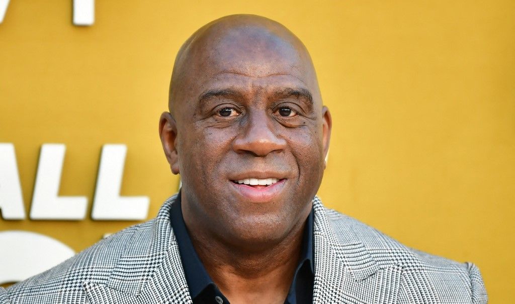 Former US professional basketball players Magic Johnson attends the Los Angeles premiere of Apple's "They Call Me Magic" at The Village Regency Theatre in Westwood, California, on April 14, 2022. (Photo by Frederic J. BROWN / AFP)