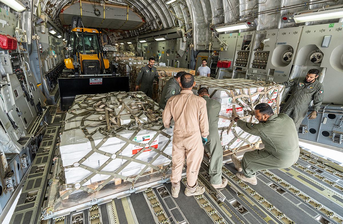 A handout photo released by the Kuwaiti News Agency (KUNA) on October 29, 2023, shows humanitarian aid bound for the Gaza Strip through Egypt's northern Rafah border crossing, being loaded into a military aircraft at the International Airport in Kuwait City, amid the ongoing battles between Israel and the Palestinian group Hamas. Thousands of civilians, both Palestinians and Israelis, have died since October 7, 2023, after Palestinian Hamas militants based in the Gaza Strip entered southern Israel in an unprecedented attack triggering a war declared by Israel on Hamas with retaliatory bombings on Gaza. (Photo by Handout / KUNA / AFP) / RESTRICTED TO EDITORIAL USE - MANDATORY CREDIT "AFP PHOTO /KUNA " - NO MARKETING NO ADVERTISING CAMPAIGNS - DISTRIBUTED AS A SERVICE TO CLIENTS