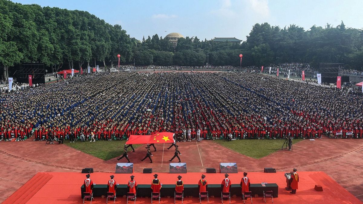 Graduates of Wuhan University attend the graduation ceremony in Wuhan, in China's central Hubei province on June 20, 2023. (Photo by AFP) / China OUT