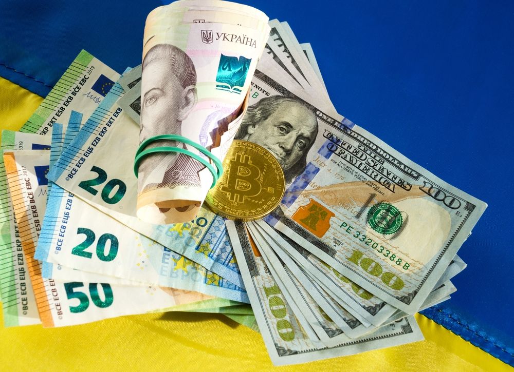 Bitcoin,,Dollars,,Euro,And,Hryvnia,On,The,Background,Of,The