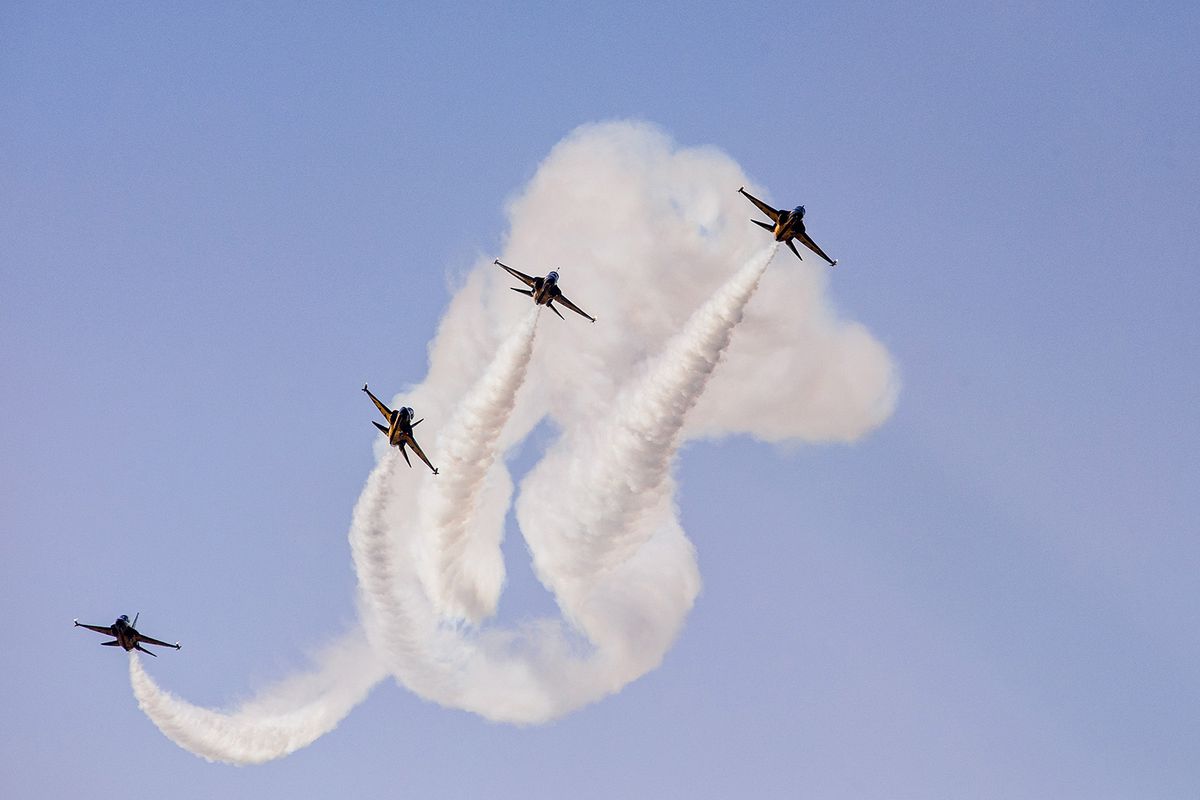 South Korea's Air Force T-50 jets of the "Black Eagles" 53rd Air Demonstration Group perform at the Seoul International Aerospace and Defense Exhibition (ADEX) in Seongnam, south of Seoul, on October 18, 2021. (Photo by Anthony WALLACE / AFP)