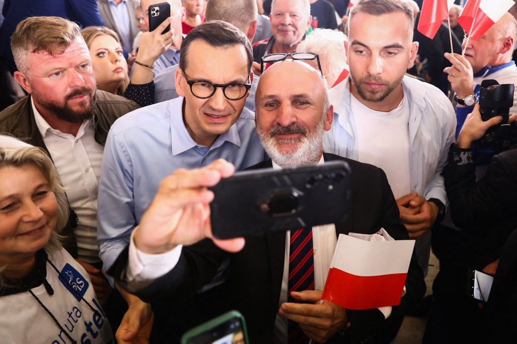 Polish Prime Minister Mateusz Morawiecki holds pre-election rally in MyslowiceMYSLOWICE, POLAND - OCTOBER 7: Polish Prime Minister Mateusz Morawiecki (C-L) poses for a photo with supporters during the ruling ‘Law and Justice’ party pre-election rally in Myslowice, Poland on October 7, 2023. Parliamentary elections will be held on Oct. 15. Jakub Porzycki / Anadolu Agency (Photo by Jakub Porzycki / ANADOLU AGENCY / Anadolu Agency via AFP)