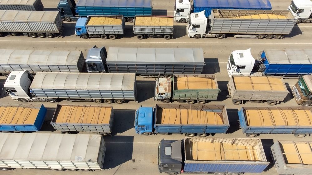 Trucks,Loaded,With,Grain,Are,Waiting,,Top,View.,Trucks,In