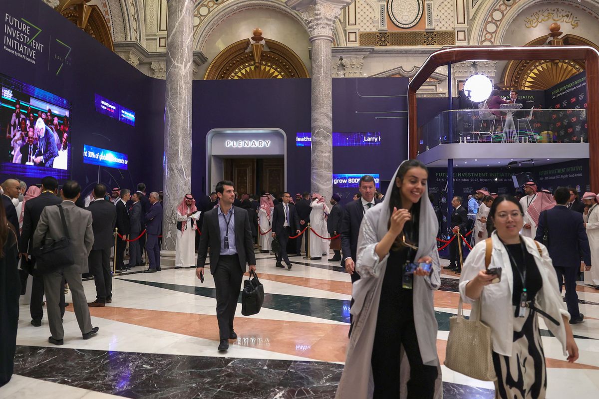 Attendees arrive for the yearly Future Investment Initiative (FII) conference in the Saudi capital Riyadh on October 24, 2023. More than 6,000 delegates are registered for the three-day event that will feature appearances by global banking chiefs and the presidents of South Korea, Kenya and Rwanda, organisers say. (Photo by Fayez Nureldine / AFP)