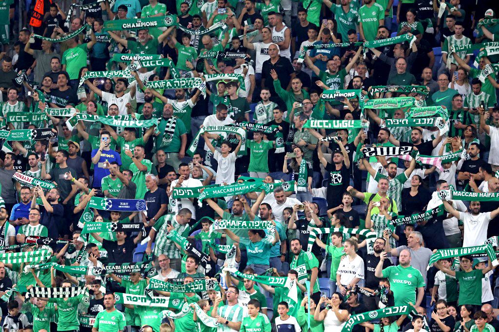 FBL-EUR-C3-MACCABI HAIFA-PANATHINAIKOS-FANSSupporters cheer ahead of the UEFA Europa League Group F football match between Israel's Maccabi Haifa and Greece's Panathinaikos at the Sammy Ofer Stadium in Haifa on October 5, 2023. (Photo by JACK GUEZ / AFP)