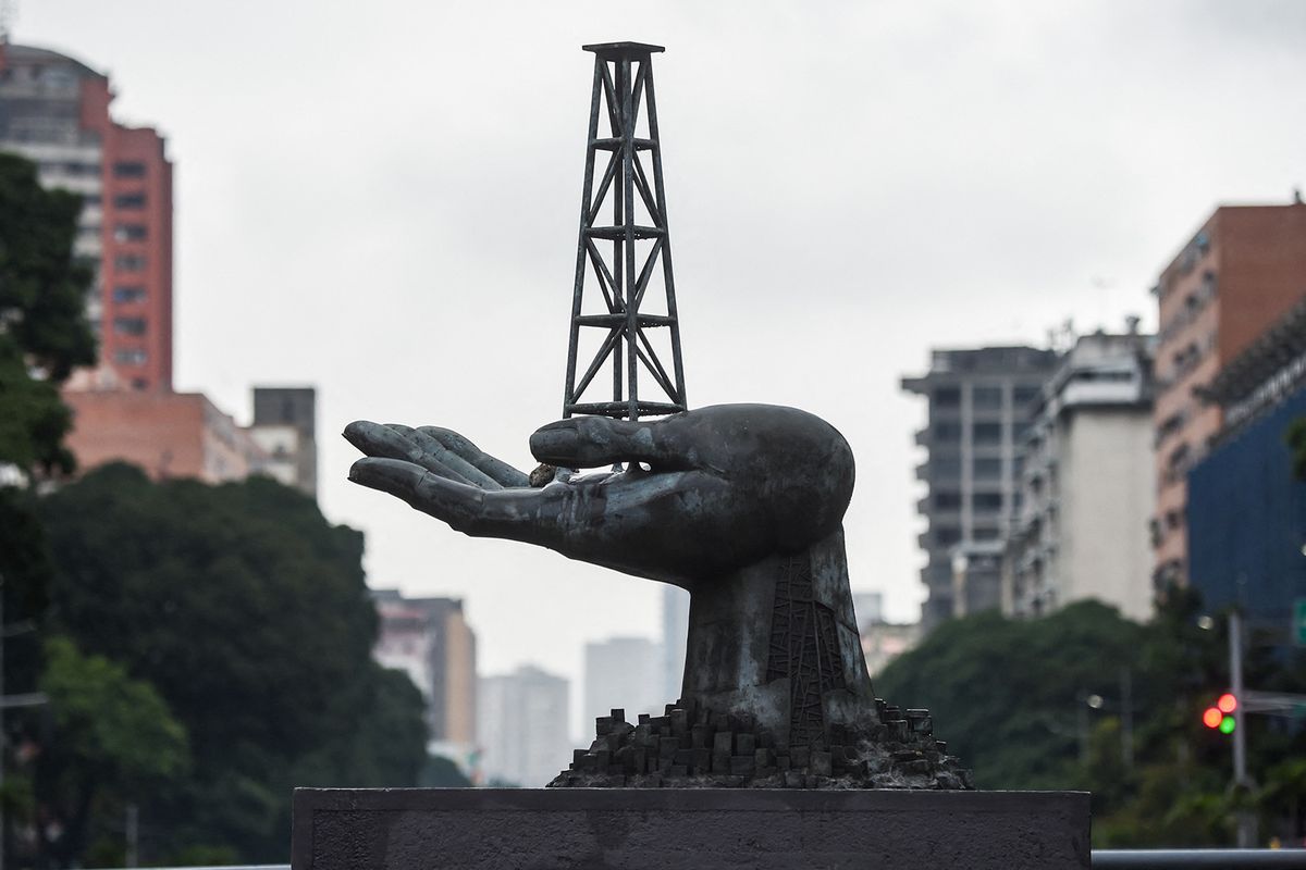 View of the Peace Monument sculpture in front of the Petroleos de Venezuela (PDVSA) headquarters in Caracas, on December 2, 2022. Chevron signed this Friday "contracts for the continuation of operations and production activities" in Venezuela, after receiving a license from the United States to partially resume its activities in this country under embargo, the Venezuelan government reported. (Photo by Miguel ZAMBRANO / AFP)
