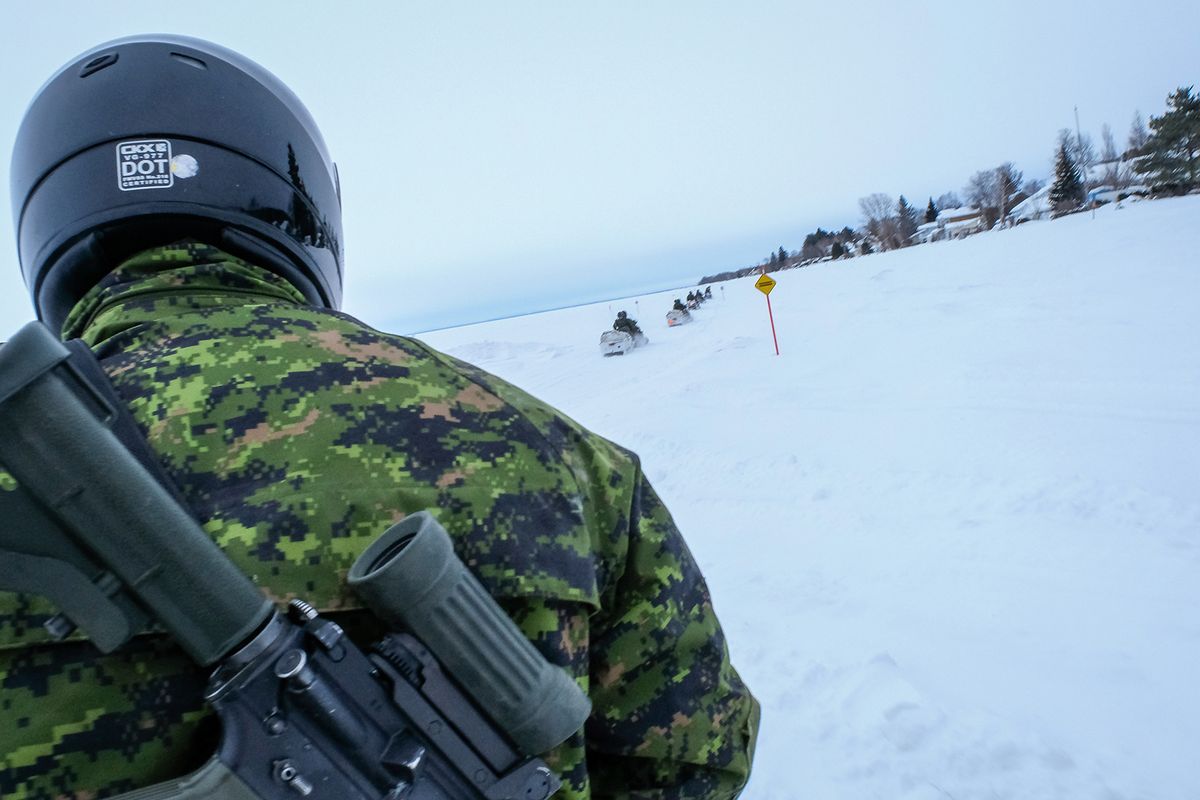 soldiers in snowmobiles during a Franco-Canadian military exercise, Quebec, Saguenay, Canada