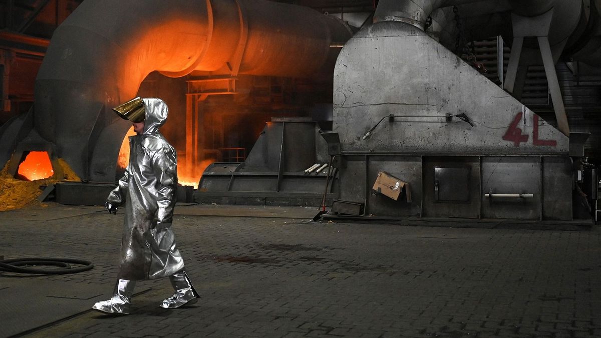 An employee walks at blast furnace 8 during the visit of the German President at the Thyssenkrupp Steel Europe on the topic "industrial transformation" in Duisburg, western Germany on May 2, 2023. (Photo by Ina FASSBENDER / AFP)