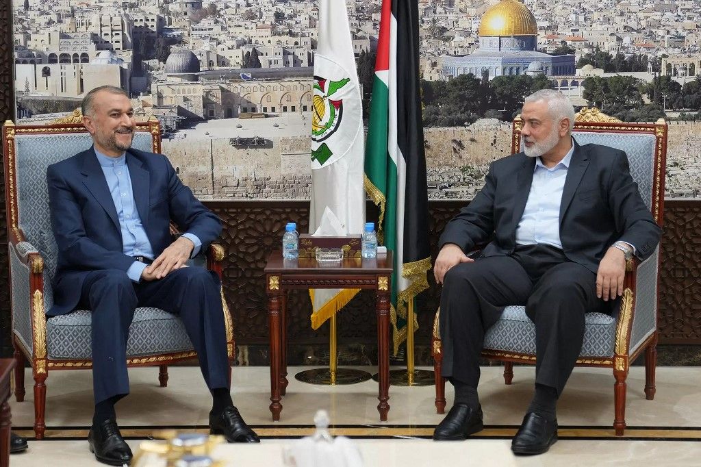 This handout picture provided by the Iranian foreign ministry on October 31, 2023, shows Foreign Minister Hossein Amir Abdollahian (L) meeting with Hamas' political bureau chief Ismail Haniyeh in Doha. (Photo by Iranian Foreign Ministry / AFP) / === RESTRICTED TO EDITORIAL USE - MANDATORY CREDIT "AFP PHOTO / HO / IRANIAN FOREIGN MINISTRY" - NO MARKETING NO ADVERTISING CAMPAIGNS - DISTRIBUTED AS A SERVICE TO CLIENTS ===