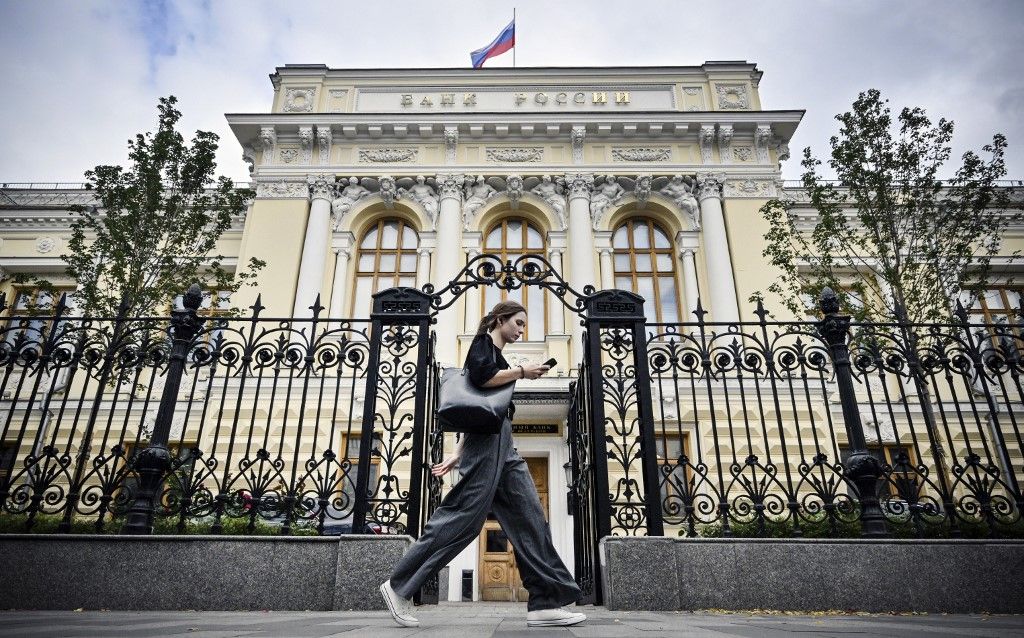 A woman walks past the Russian Central Bank headquarters in downtown Moscow on September 6, 2023. Russia's central bank announced on September 6, 2023 it plans to sharply step up support for the ruble, which has weakened considerably after 18 months of Western sanctions following Moscow's military intervention in Ukraine. The Bank of Russia said that between September 14 and 22 it would sell each day 21.4 billion rubles ($218.5 million) of foreign currency on the market, about 10 times the current volume it is selling on a daily basis. (Photo by Alexander NEMENOV / AFP)