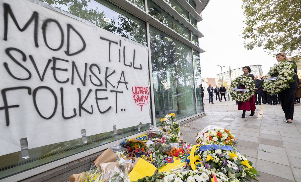 Belgiun Foreign Minister Hadja Lahbib (L) and Belgium Interior Minister Annelies Verlinden (R) lay flowers at a commemoration for the victims of the terrorist attack where two Swedish nationals were killed, in Brussels on October 18, 2023. Brussels police on October 17, 2023 shot and fatally wounded an attacker accused of gunning down two Swedish football fans in what Belgium's prime minister condemned as an act of "terrorist madness". (Photo by BENOIT DOPPAGNE / Belga / AFP) / Belgium OUT