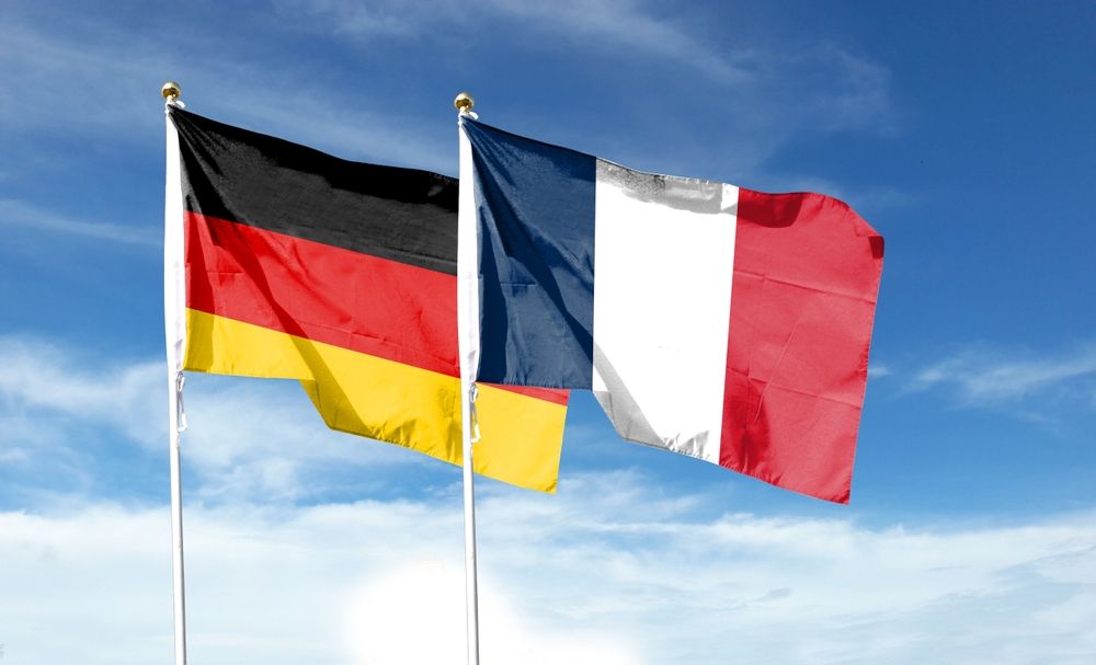 Flags,Of,France,Flag,And,Germany,Flag,Against,Cloudy,Sky.