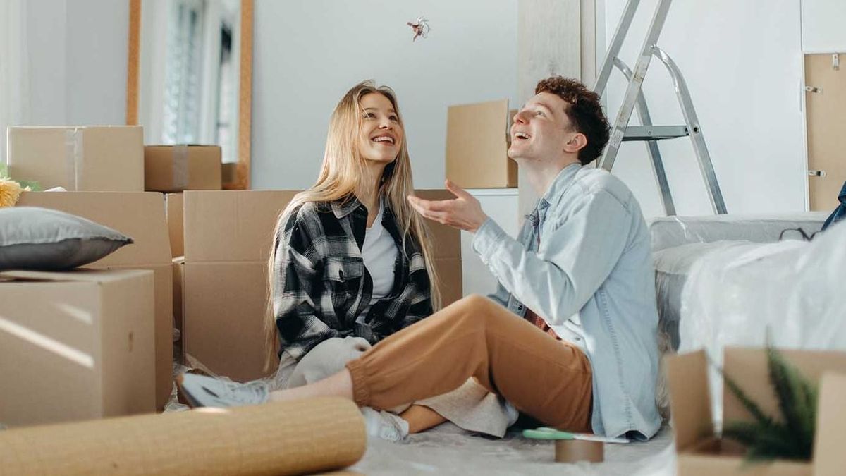 Cheerful,Young,Couple,In,Their,New,Apartment.,Conception,Of,Moving.