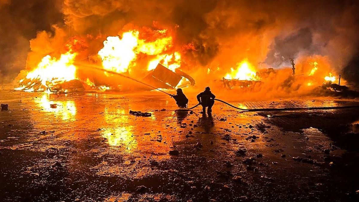 This handout photograph taken and released by Ukrainian emergency service on October 6, 2023, shows firefighters working to extinguish a fire on the port infrastructure on the Danube river, in the Odesa region, amid the Russian invasion in Ukraine. (Photo by Handout / AFP) / RESTRICTED TO EDITORIAL USE - MANDATORY CREDIT "AFP PHOTO /   " - NO MARKETING NO ADVERTISING CAMPAIGNS - DISTRIBUTED AS A SERVICE TO CLIENTS