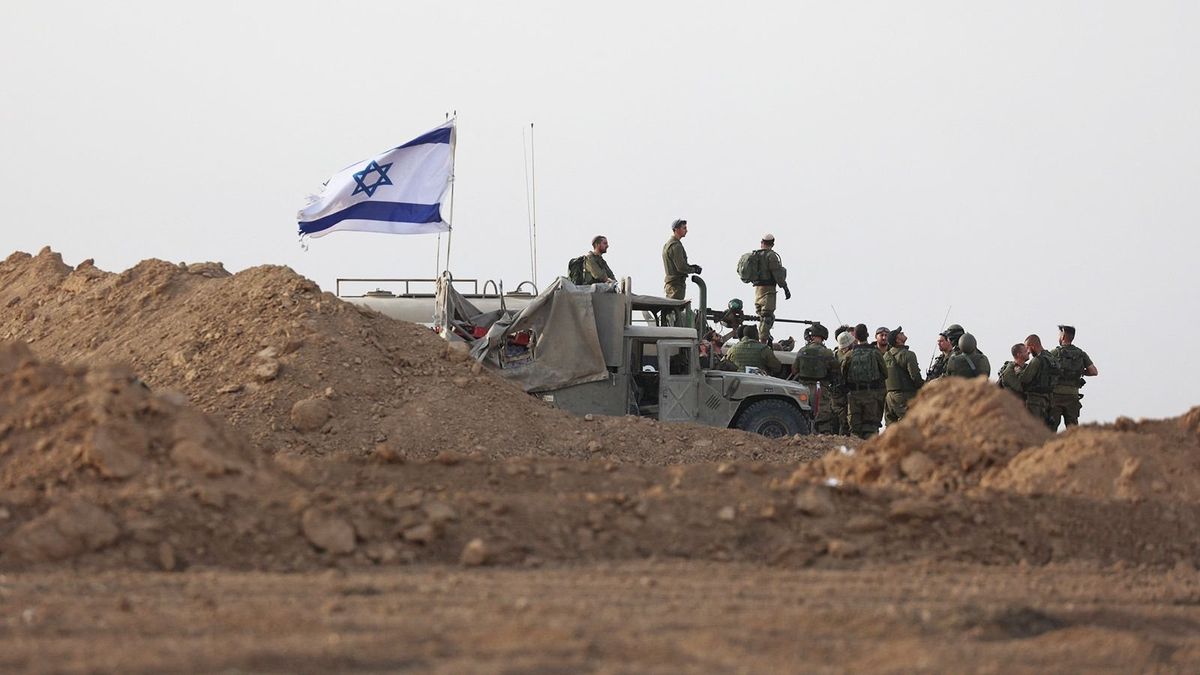 Israeli troops gather near the border with Gaza before entering the Palestinian strip on October 29, 2023, amid ongoing battles between Israel and the Palestinian Hamas movement. (Photo by Gil COHEN-MAGEN / AFP)