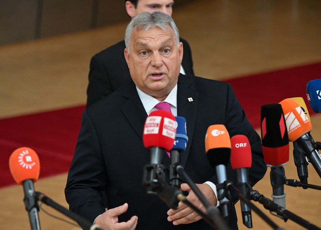 Hungary's Prime Minister Viktor Orban addresses the press as he arrives for a EU leaders Summit at The European Council Building in Brussels on October 26, 2023. EU leaders will debate starting October 26, 2023, in a two day summit in Brussels, for a call for humanitarian "pauses" in Israel's war with Hamas, as the bloc grapples with another conflict on its fringes alongside Russia's invasion of Ukraine. (Photo by JOHN THYS / AFP)