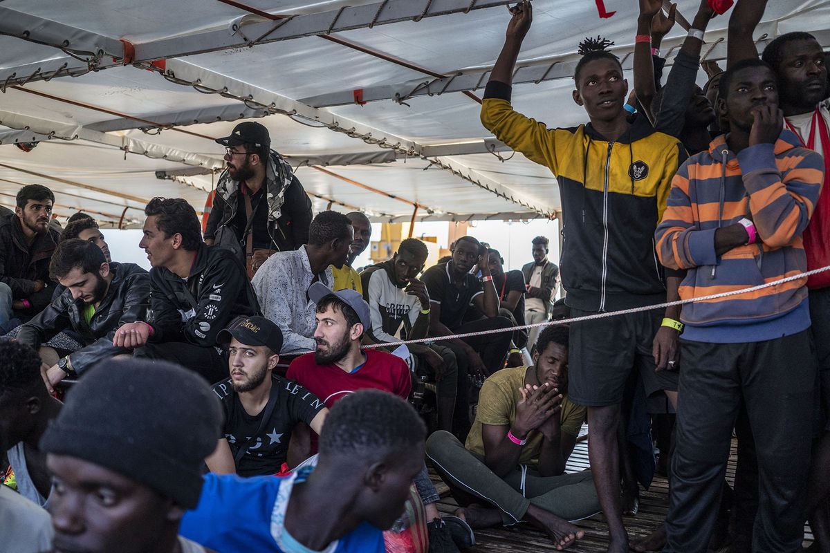 Spanish NGO rescues 176 irregular migrants in international waters
CARRARA, ITALY - OCTOBER 04: Survived migrants wait to be disembarked from the ship who were rescued by the Spanish NGO 'Open Arms' in Carrara, Italy on October 04, 2023. About 176 migrants of 14 different nationalities from Syria, Bangladesh, Sudan, Eritrea, Palestine, Guinea, Gambia, Guinea Bissau, Ghana, Egypt, Chad, Senegal and Mali were rescued by 'Open Arms' who carried out 3 rescue operations at the international waters of the Central Mediterranean sea. Jose Colon / Anadolu Agency (Photo by JOSE COLON / ANADOLU AGENCY / Anadolu via AFP)