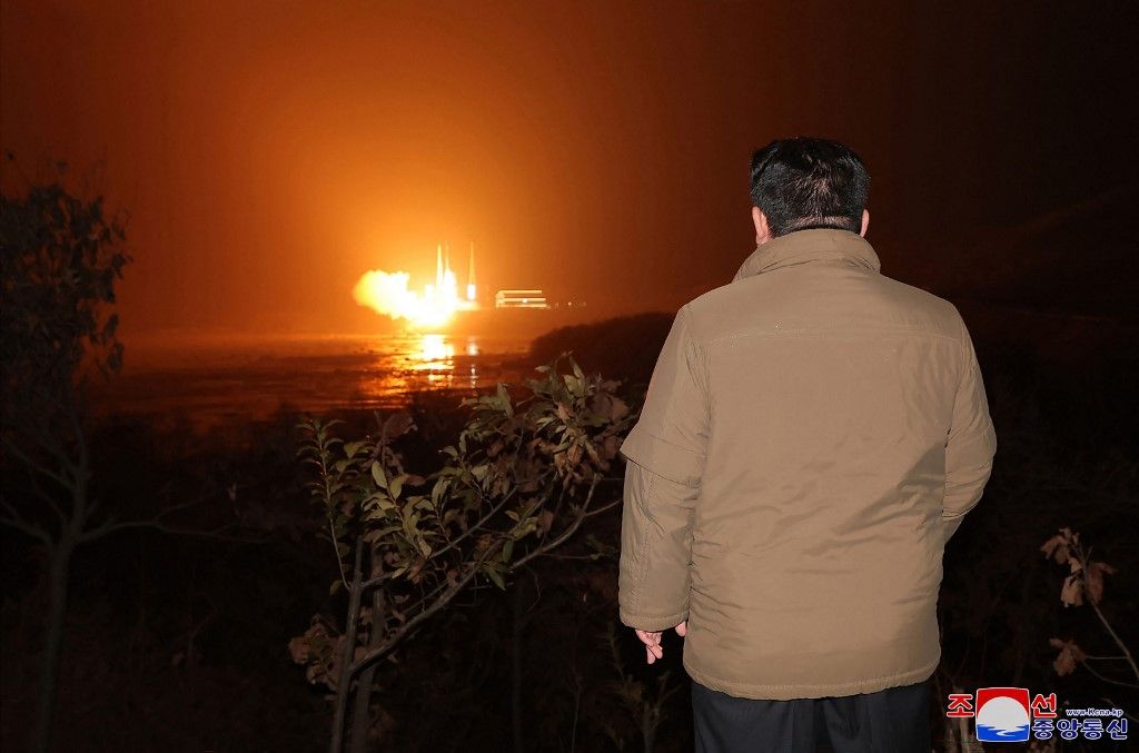 This picture taken on November 21, 2023 and released from North Korea's official Korean Central News Agency (KCNA) on November 22, 2023 shows North Korea's leader Kim Jong Un inspecting the launch of a rocket carrying the reconnaissance satellite 'Malligyong-1' from the Sohae Satellite Launch Site in North Phyongan province. North Korea said on November 22 it had succeeded in putting a military spy satellite in orbit after two previous failures, as the US led its allies in condemning the launch as a "brazen violation" of UN sanctions. (Photo by KCNA VIA KNS / AFP) / South Korea OUT / REPUBLIC OF KOREA OUT
---EDITORS NOTE--- RESTRICTED TO EDITORIAL USE - MANDATORY CREDIT "AFP PHOTO/KCNA VIA KNS" - NO MARKETING NO ADVERTISING CAMPAIGNS - DISTRIBUTED AS A SERVICE TO CLIENTS / THIS PICTURE WAS MADE AVAILABLE BY A THIRD PARTY. AFP CAN NOT INDEPENDENTLY VERIFY THE AUTHENTICITY, LOCATION, DATE AND CONTENT OF THIS IMAGE --- / 