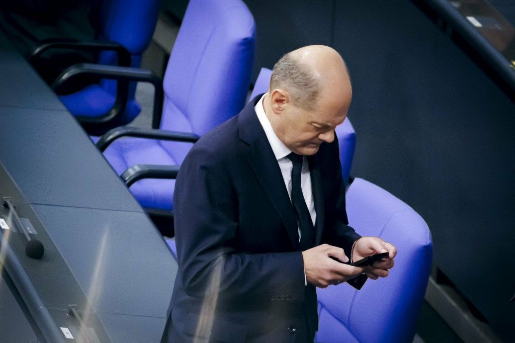 Government survey Olaf ScholzOlaf Scholz (SPD), Chancellor, looks at his smartphone before the start of a government survey in the German Bundestag. Berlin, November 15, 2023. (Photo by Thomas Trutschel / Photothek / dpa Picture-Alliance via AFP)
