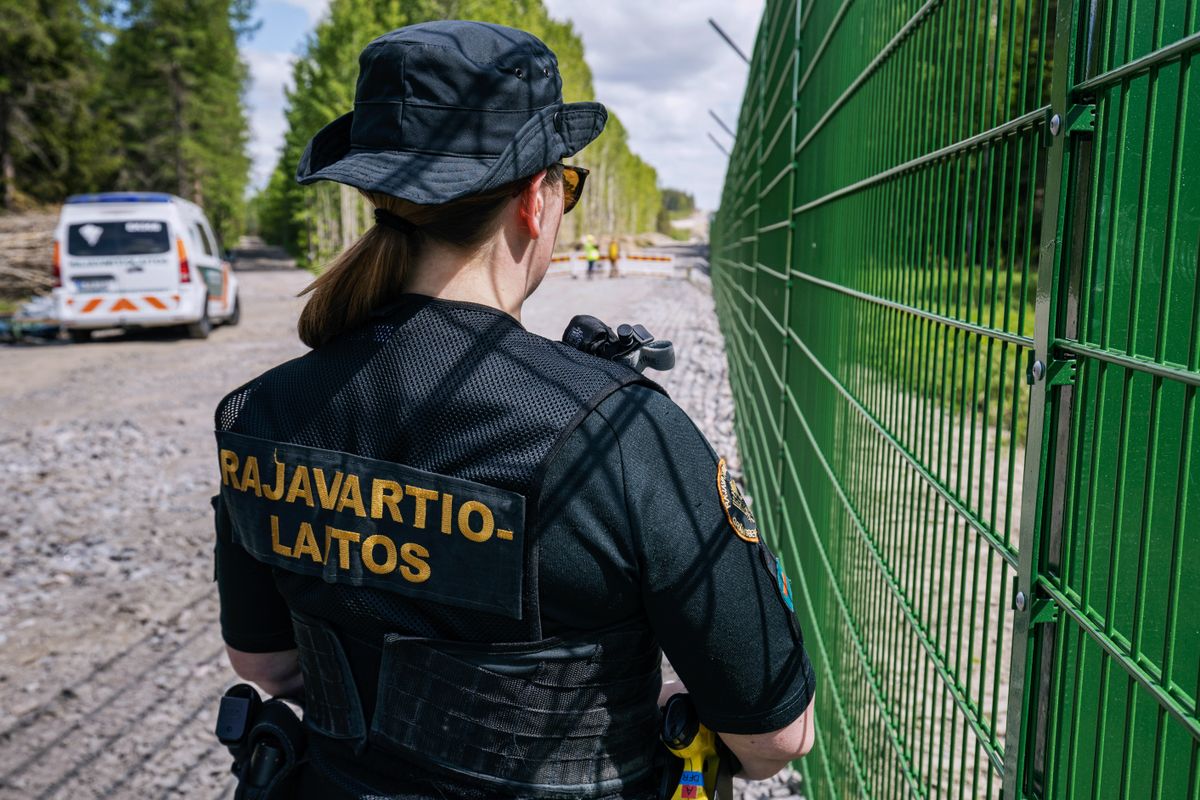 Finland's Border Fence on Parts of NATO's Eastern FlankA Finnish border guard at a section of the initial 3-kilometer (1.9-mile) stretch of fence under construction near a border crossing near Imatra, in southeast Finland, on Tuesday, May 30, 2023. The Finnish fence won't span the entire 1,343-kilometer length of the demarcation, but instead the plan is to cover the riskiest spots, especially around crossing points, against targeted mass entry. Photographer: Roni Rekomaa/Bloomberg via Getty ImagesA Finnish border guard at a section of the initial 3-kilometer (1.9-mile) stretch of fence under construction near a border crossing near Imatra, in southeast Finland, on Tuesday, May 30, 2023. The Finnish fence won't span the entire 1,343-kilometer length of the demarcation, but instead the plan is to cover the riskiest spots, especially around crossing points, against targeted mass entry. Photographer: Roni Rekomaa/Bloomberg
