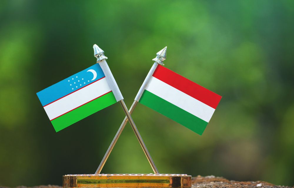 Hungary,And,Uzbekistan,Small,Flag,With,Blur,Green,Background