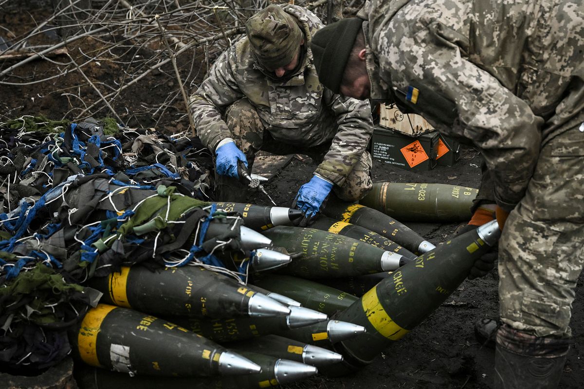 Ukrainian servicemen prepare to fire towards Russian positions with a 155mm M777 Howitzer artillery weapon on the front line somewhere near the city of Bakhmut on March 11, 2023 amid the Russian invasion of Ukraine. (Photo by Aris Messinis / AFP)