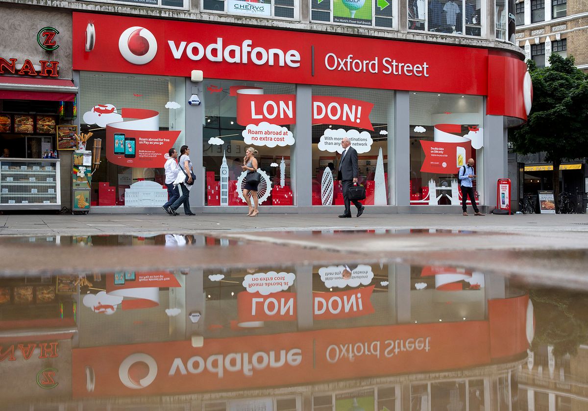 A Vodafone store is pictured in central London on July 22, 2016. British telecoms giant Vodafone reported better than expected group service revenues for its mobile phone businesses today in the first quarter despite continued weak performance in the UK. (Photo by JUSTIN TALLIS / AFP)