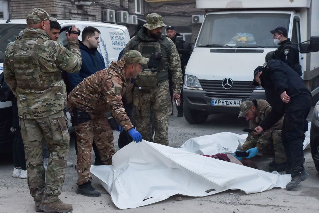 (EDITORS NOTE: Image depicts death) 
Police officers inspectZAPORIZHZHIA, UKRAINE - 2023/10/18: (EDITORS NOTE: Image depicts death) 
Police officers inspect the lifeless body of a resident killed following a Russian missile attack in Zaporizhzhia. On October 18, Russian forces fired six missiles at the city of Zaporizhia. One of these missiles hit a multi-story residential building in the city center, resulting in the tragic loss of five lives, according to the Zaporizhia Regional Military Administration. (Photo by Andriy Andriyenko/SOPA Images/LightRocket via Getty ZAPORIZHZHIA, UKRAINE - 2023/10/18: (EDITORS NOTE: Image depicts death) Police officers inspect the lifeless body of a resident killed following a Russian missile attack in Zaporizhzhia. On October 18, Russian forces fired six missiles at the city of Zaporizhia. One of these missiles hit a multi-story residential building in the city center, resulting in the tragic loss of five lives, according to the Zaporizhia Regional Military Administration. (Photo by Andriy Andriyenko/SOPA Images/LightRocket via Getty Images)Images)