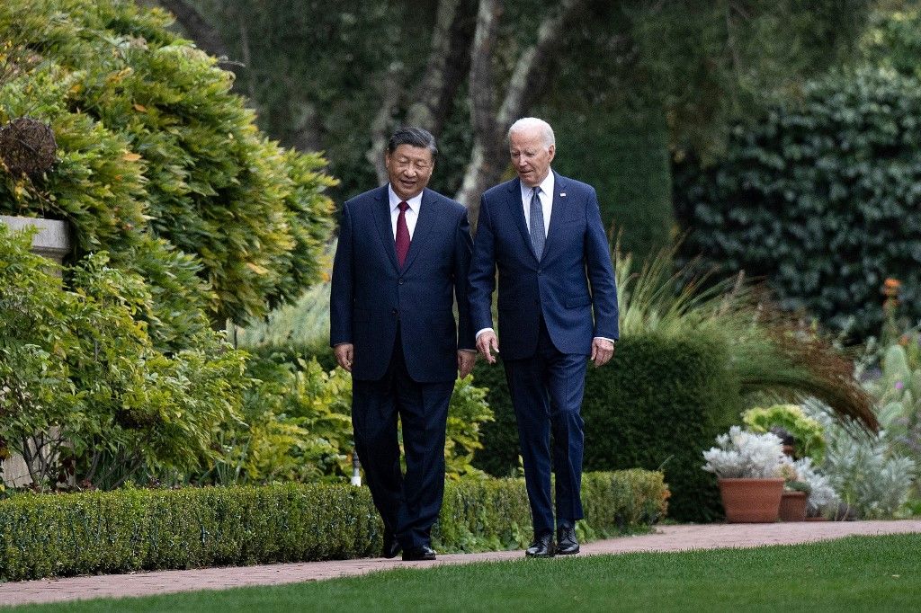 US President Joe Biden (R) and Chinese President Xi Jinping walk together after a meeting during the Asia-Pacific Economic Cooperation (APEC) Leaders' week in Woodside, California on November 15, 2023. Biden and Xi will try to prevent the superpowers' rivalry spilling into conflict when they meet for the first time in a year at a high-stakes summit in San Francisco on Wednesday. With tensions soaring over issues including Taiwan, sanctions and trade, the leaders of the world's largest economies are expected to hold at least three hours of talks at the Filoli country estate on the city's outskirts. (Photo by Brendan Smialowski / AFP)