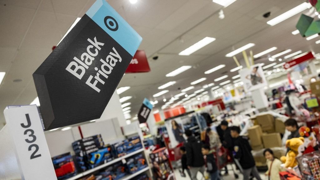 A Black Friday sales signs are posted at a Target store in Rockville, Maryland, on November 25, 2022 . With inflation on the rise, retailers are expecting that many shoppers will be looking for especially good deals as discretionary spending falls. (Photo by SAMUEL CORUM / AFP)
a Black Friday