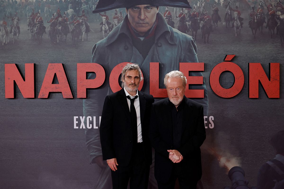 British and US movie director Ridley Scott (R) and US actor Joaquin Phoenix pose for a photocall of the movie Napoleon, in Madrid on November 20, 2023. (Photo by OSCAR DEL POZO / AFP)
