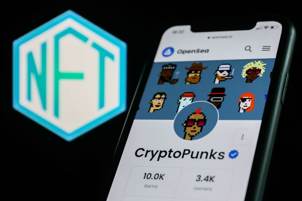 NFT And Cryptocurrencies Photo IllustrationsCryptoPunks collection in OpenSea displayed on a phone screen and NFT logo displayed on a screen are seen in this illustration photo taken in Krakow, Poland on April 19, 2022. (Photo by Jakub Porzycki/NurPhoto via Getty Images)CryptoPunks collection in OpenSea displayed on a phone screen and NFT logo displayed on a screen are seen in this illustration photo taken in Krakow, Poland on April 19, 2022. (Photo by Jakub Porzycki/NurPhoto)
