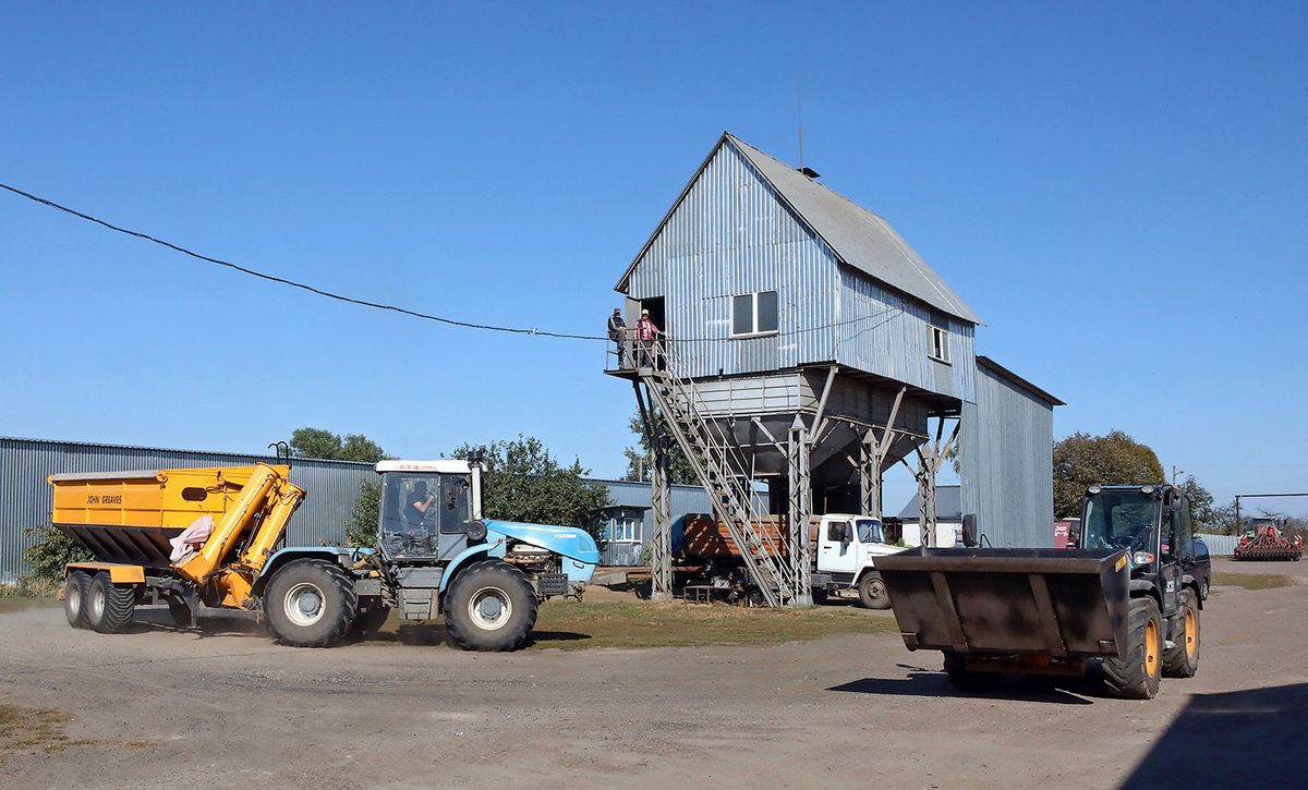 ANYSIV, UKRAINE - SEPTEMBER 27, 2023 - A tractor and loader are seen at the Herasymenko Farm, formerly known as Steviia, that was damaged in the shelling of Russian troops, Anysiv village, Chernihiv Region, northern Ukraine. NO USE RUSSIA. NO USE BELARUS. (Photo by Ukrinform/NurPhoto) (Photo by Volodymyr Tarasov / NurPhoto / NurPhoto via AFP)