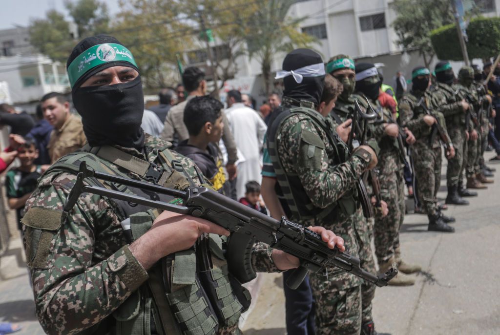 Masked members of the Hamas Islamist movement stand guard in