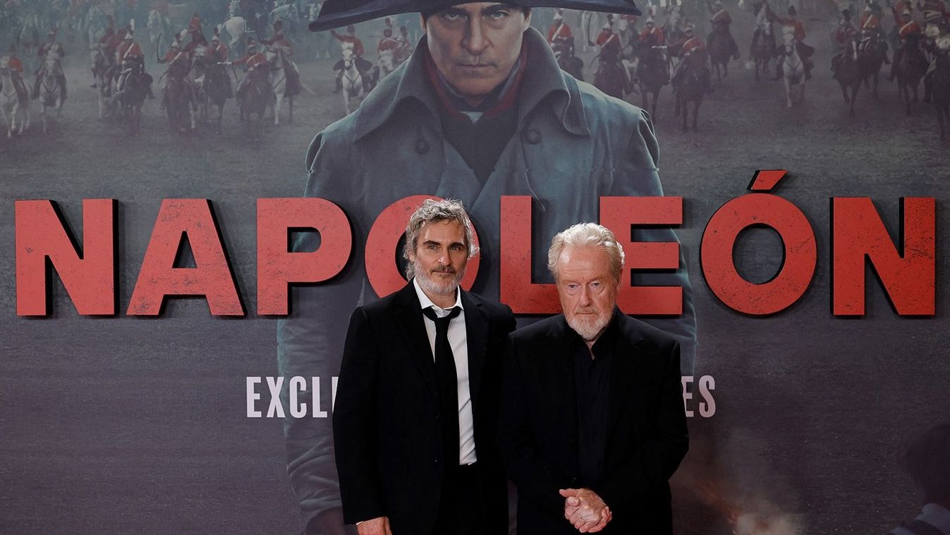 British and US movie director Ridley Scott (R) and US actor Joaquin Phoenix pose for a photocall of the movie Napoleon, in Madrid on November 20, 2023. (Photo by OSCAR DEL POZO / AFP)