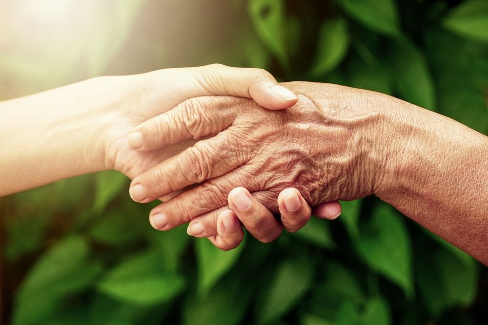 Handshake,Between,Senior,Over,Old,(elderly)and,Mid-aged,Woman.,The,Senior's