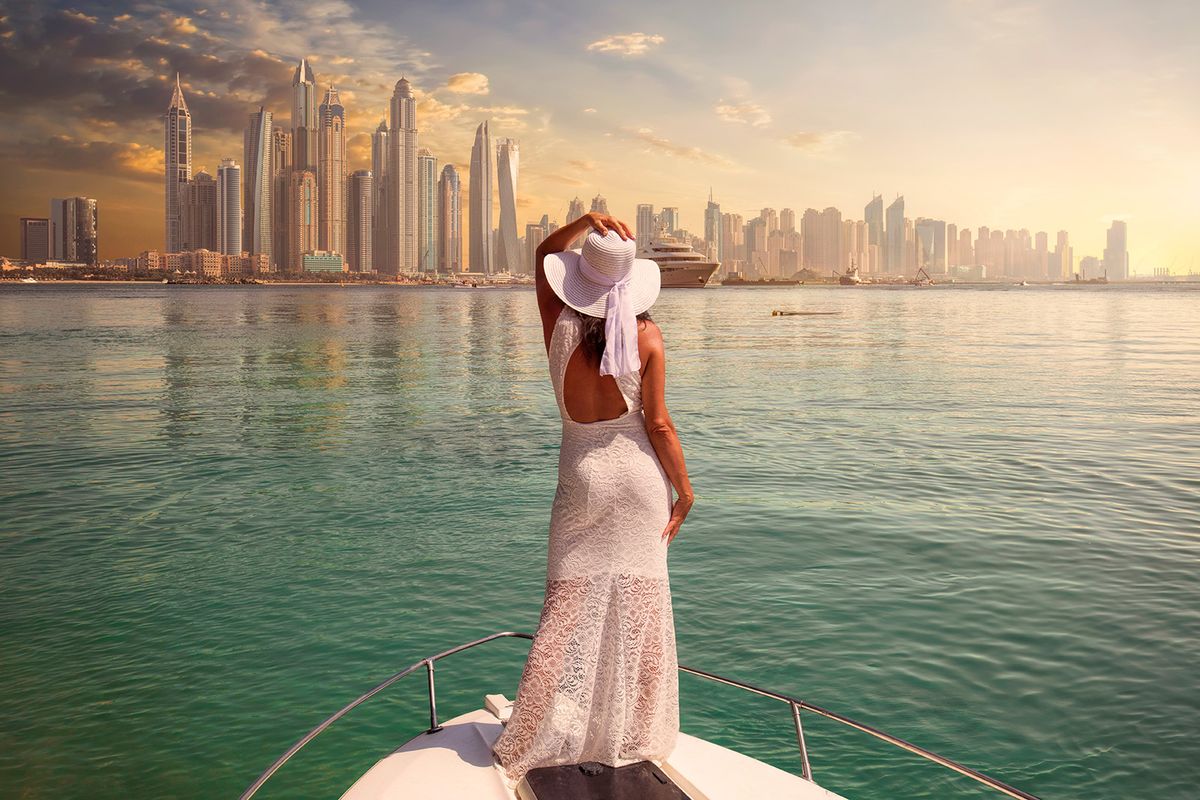 Woman,In,A,White,Dress,Is,Standing,On,A,Boat